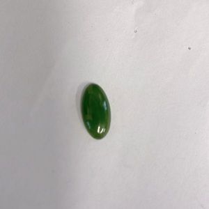 Genuine oval Jade stone in mint condition aprox 3/4” vivid dark color .